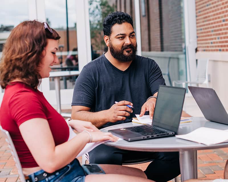 Anthropology students studying outside.