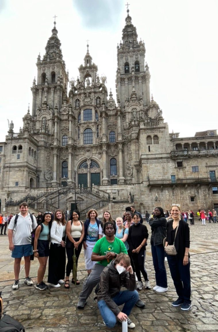 Group of CAS students posing in front of a historical landmark