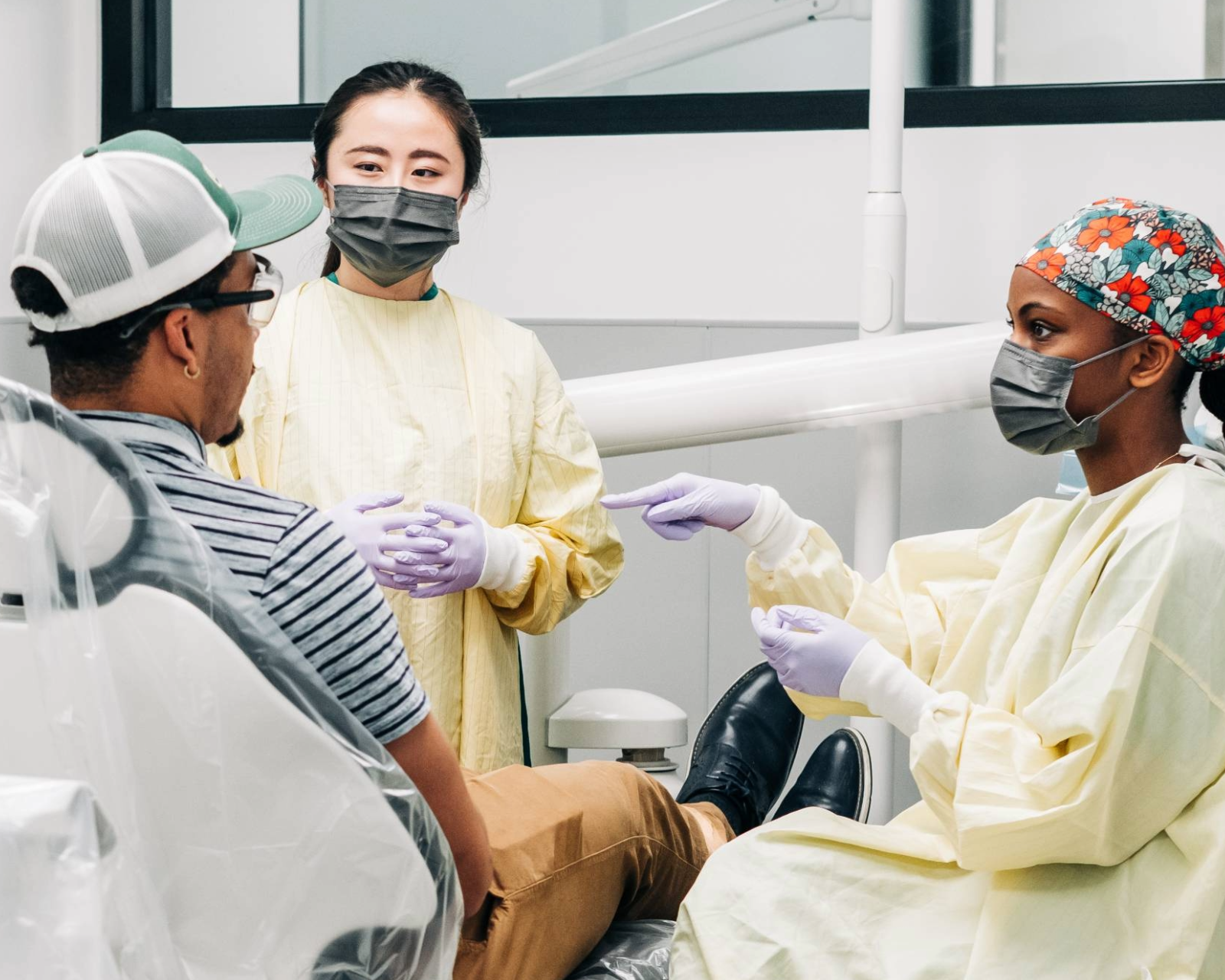 Dentist looking at computer screen.