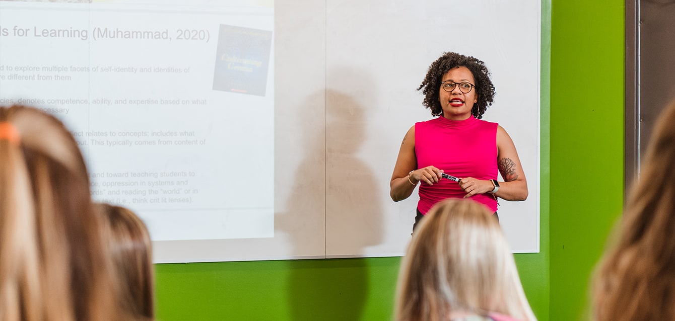 An SEHS professor teaching class.