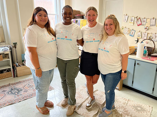 Dr. Cora Causey with UAB education students and alumna.