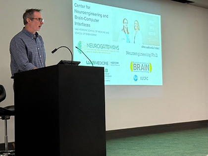 man speaking at podium