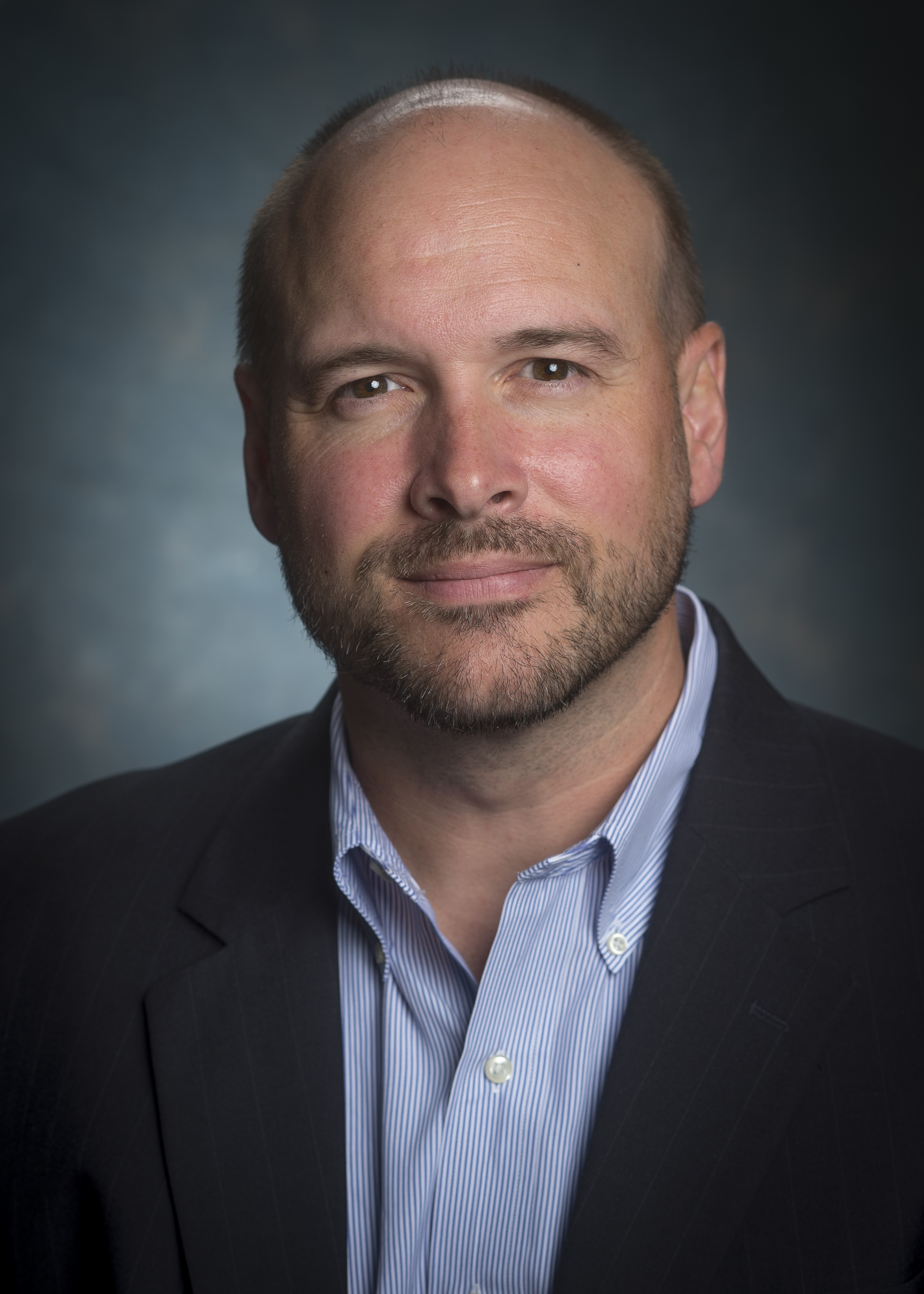 Headshot photo of faculty member Jason Warram.