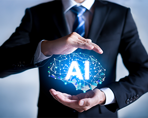 Close-up of man in suit holding a graphic of a brain with AI written on it