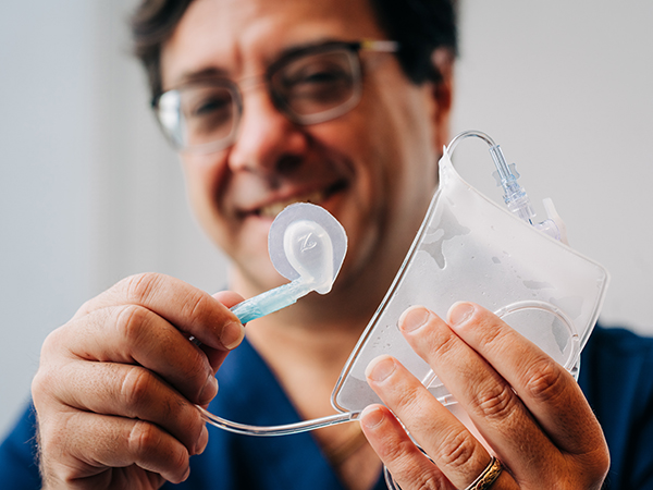 David Askenazi holds the Zorro-Flow device.