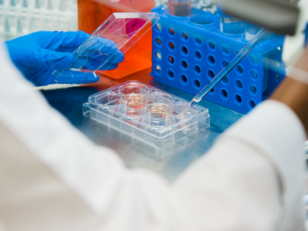 A UAB scientist performs lab research.