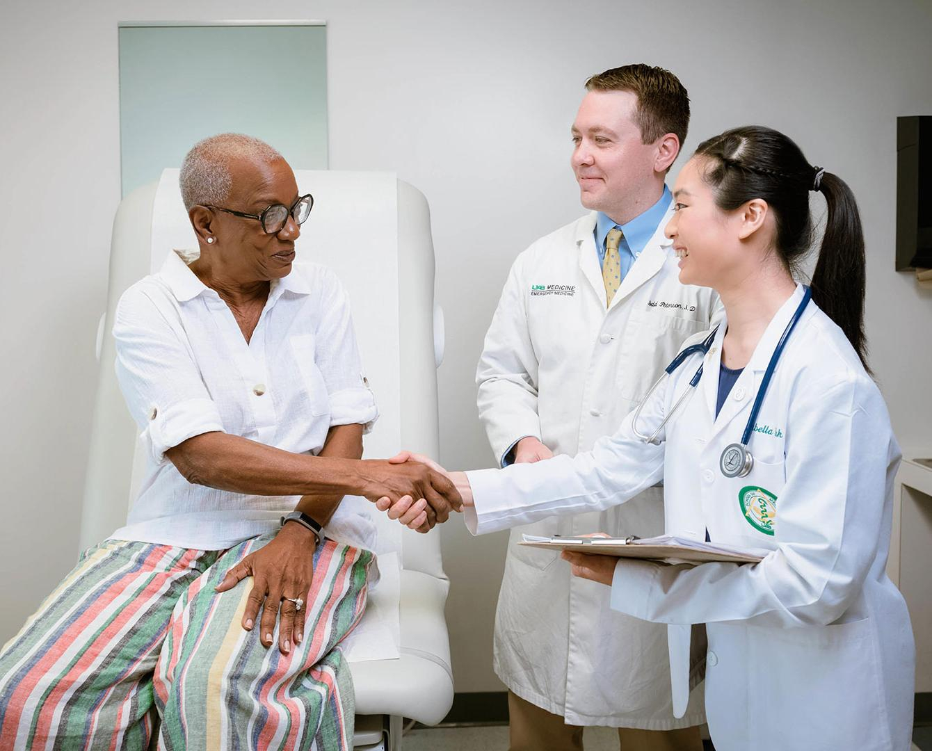 medical student shaking hands with patient 2