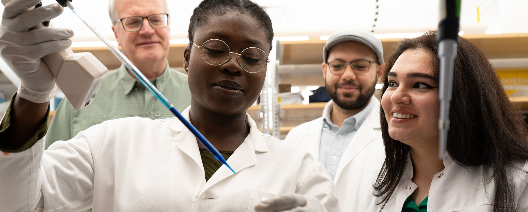 Dr. Engelhardt, Atanda, Abdalla, and Hajibabazade working in the lab.