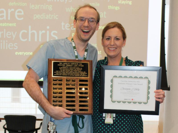 Chris Turley, M.D. and Candice Dye, M.D. holding the Carolyn Ashworth Award