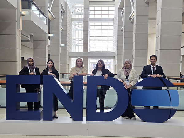 UAB endocrinology fellows standing in front of sign at 2026 Endocrine Society meeting.