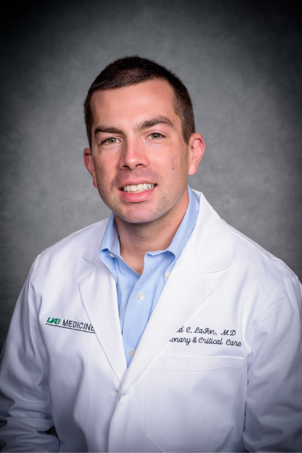 David LaFon, M.D., wears a white lab coat in front of a gray background.