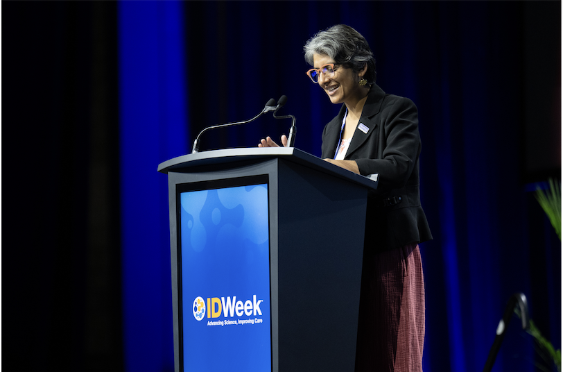 Patel giving speech after receiving HIVMA award