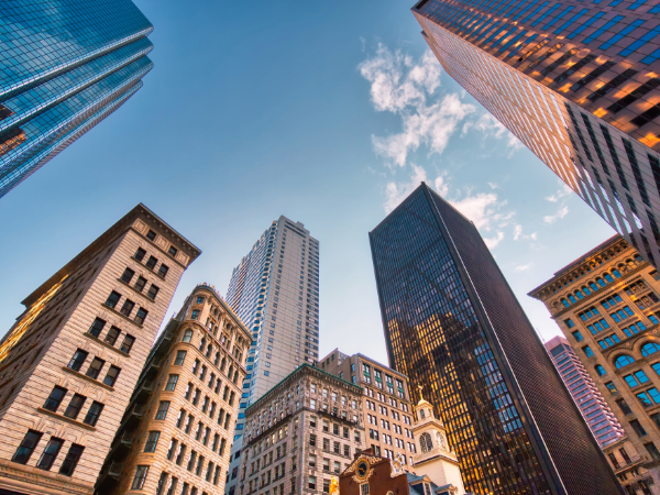 View looking up at the sky with buildings in Boston, MA rising above head.