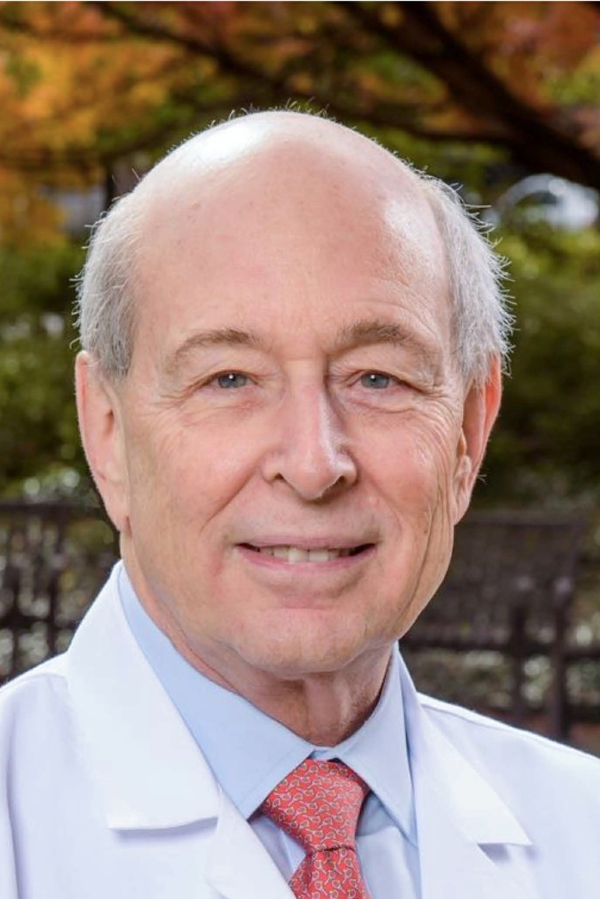 Ronald Lazar, Ph.D., stands outdoors.