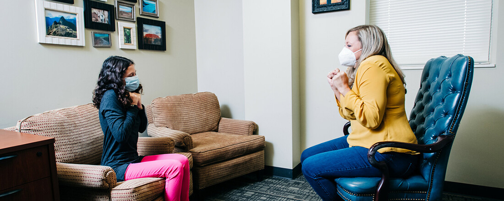Psychiatrist sitting across from patient