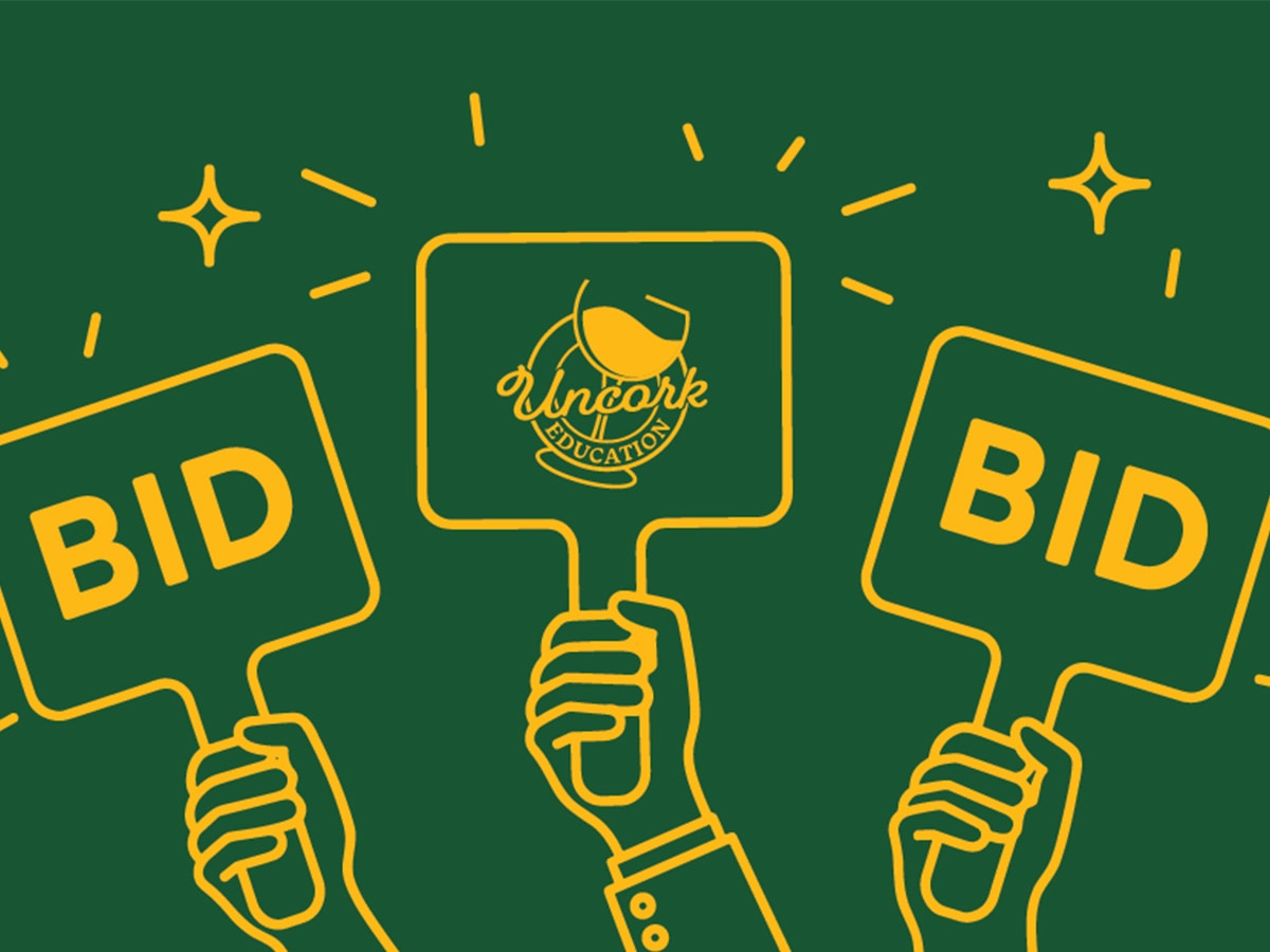 A green and gold graphic featuring a crowd of hands holding bid signs, with one of them being an Uncork Education sign.