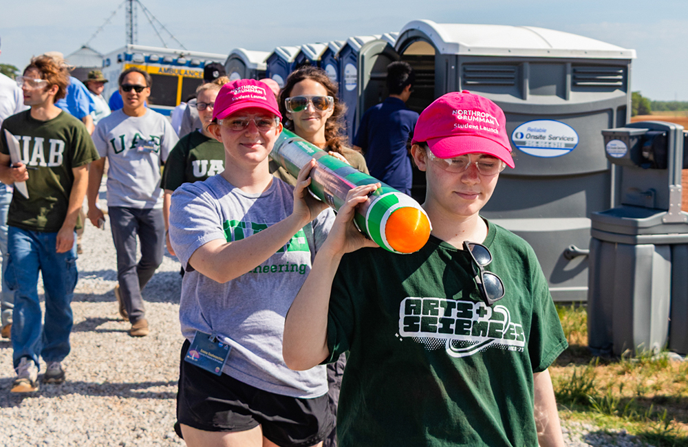 Rocketry Club at UAB team members carry Vulcan I to the launch area in Huntsville