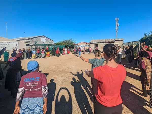 The UAB OT Education Abroad group joined the Grannies of GAPA in the organization's Tuesday Health Club, where exercises support strength, balance, and continued engagement in community work.
