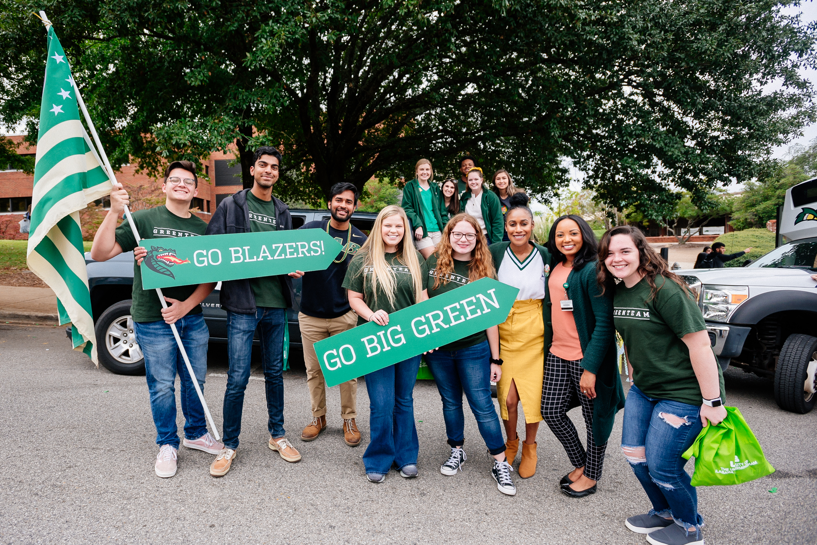 homecoming parade students with go blazers signs