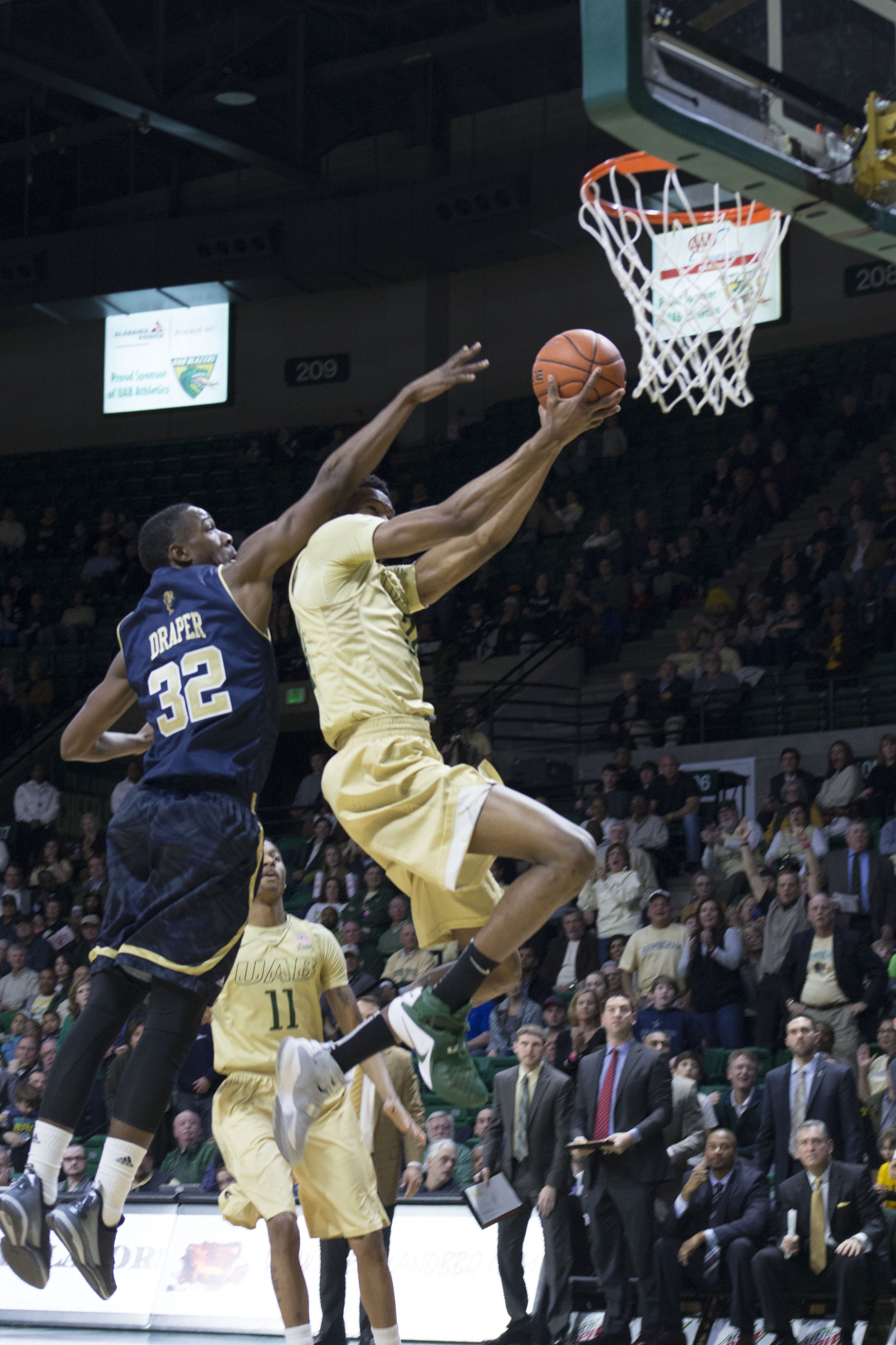 William "Haha" Lee breaks past FIU's defense for layup Thursday night. (Photo by Leonardo Carrubba).