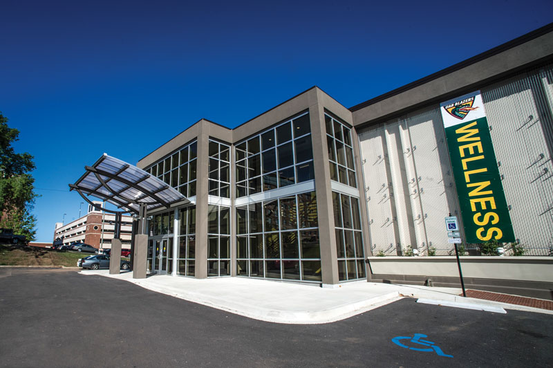 Exterior photo of a UAB building with a Wellness sign hanging