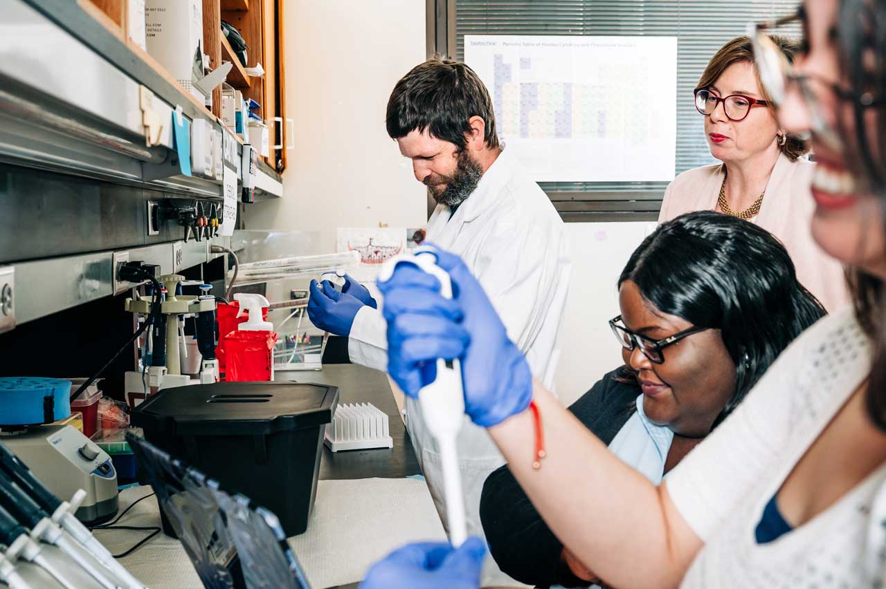 Paige Porrett and lab researchers in high-profile transplant lab.